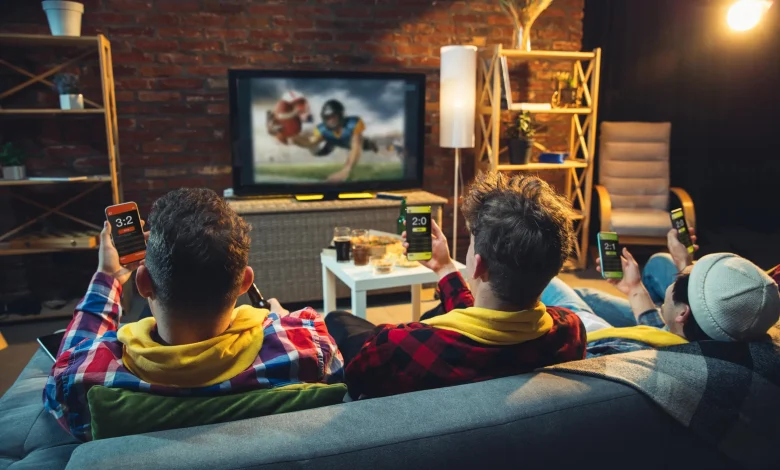 group friends watching tv sport match together emotional fans cheering favourite team watching exciting football concept friendship leisure activity emotions 1 min scaled.jpg